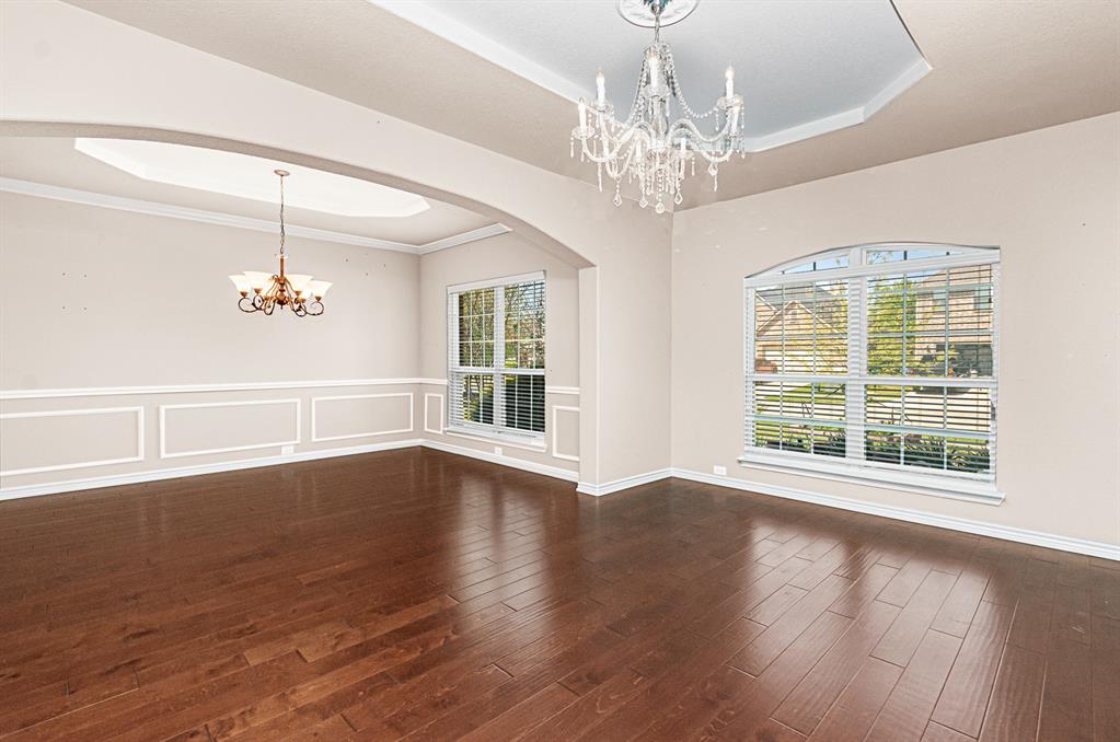 1325 Bateman Lane Celina, TX 75009 - Photo 6 of 39 a view of an empty room with wooden floor and a window