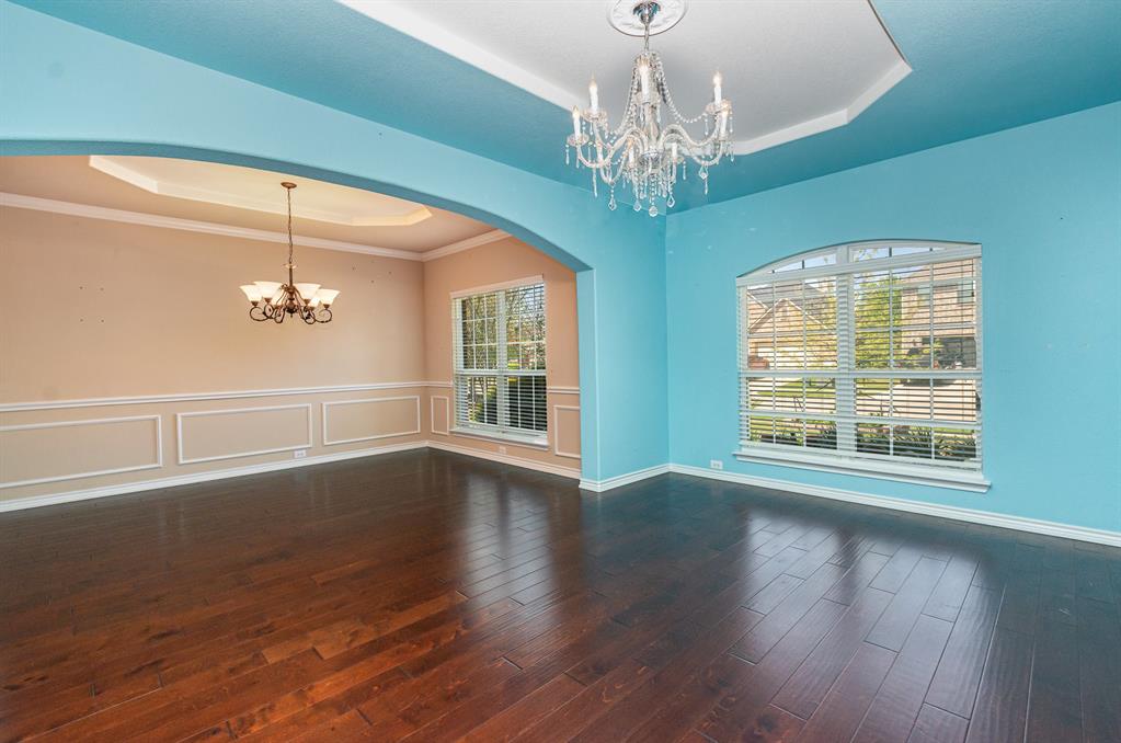 1325 Bateman Lane Celina, TX 75009 - Photo 7 of 39 a view of an empty room with wooden floor and a window