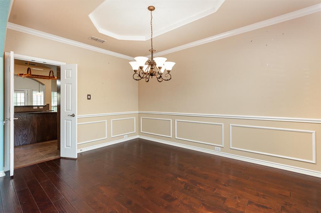 1325 Bateman Lane Celina, TX 75009 - Photo 8 of 39 a view of an empty room with wooden floor