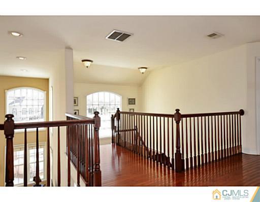 4 Rustic Court Monroe Township, NJ 08831 - Photo 14 of 25 a view of hallway with wooden floor
