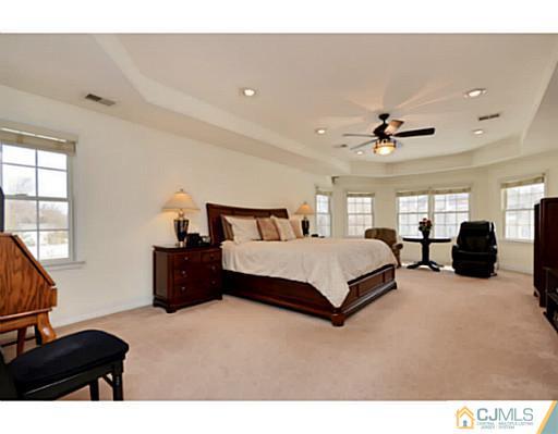 4 Rustic Court Monroe Township, NJ 08831 - Photo 15 of 25 a spacious bedroom with a bed window and dresser