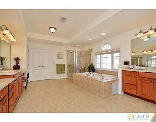 4 Rustic Court Monroe Township, NJ 08831 - Photo 17 of 25 a large room with lots of counter space and windows