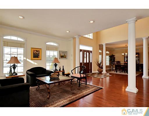 4 Rustic Court Monroe Township, NJ 08831 - Photo 3 of 25 a living room with furniture and wooden floor