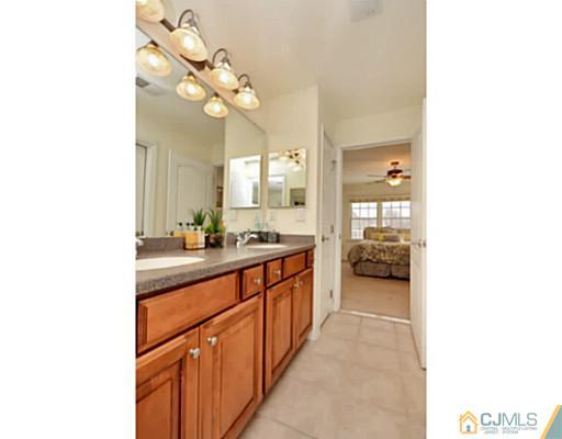 4 Rustic Court Monroe Township, NJ 08831 - Photo 22 of 25 a spacious bathroom with a sink and a mirror