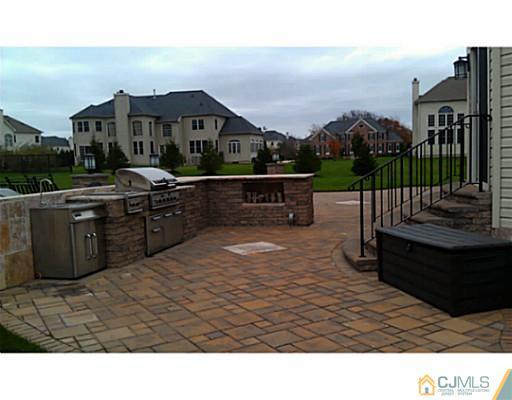 4 Rustic Court Monroe Township, NJ 08831 - Photo 24 of 25 a terrace with outdoor seating and city view