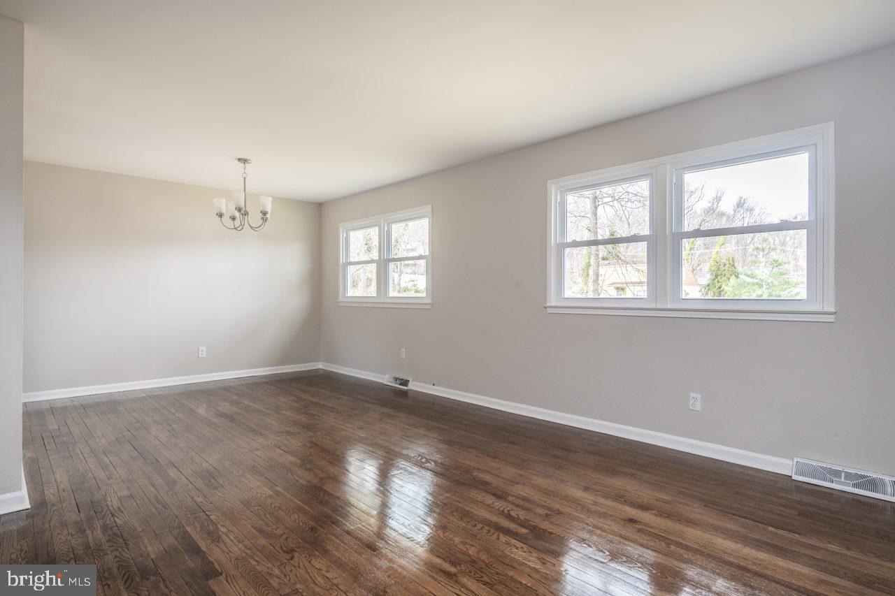2004 Brierhill Road Fort Washington, MD 20744 - Photo 11 of 42 a view of an empty room with wooden floor and a window
