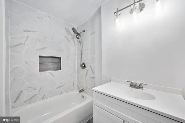 a bathroom with a sink and a shower