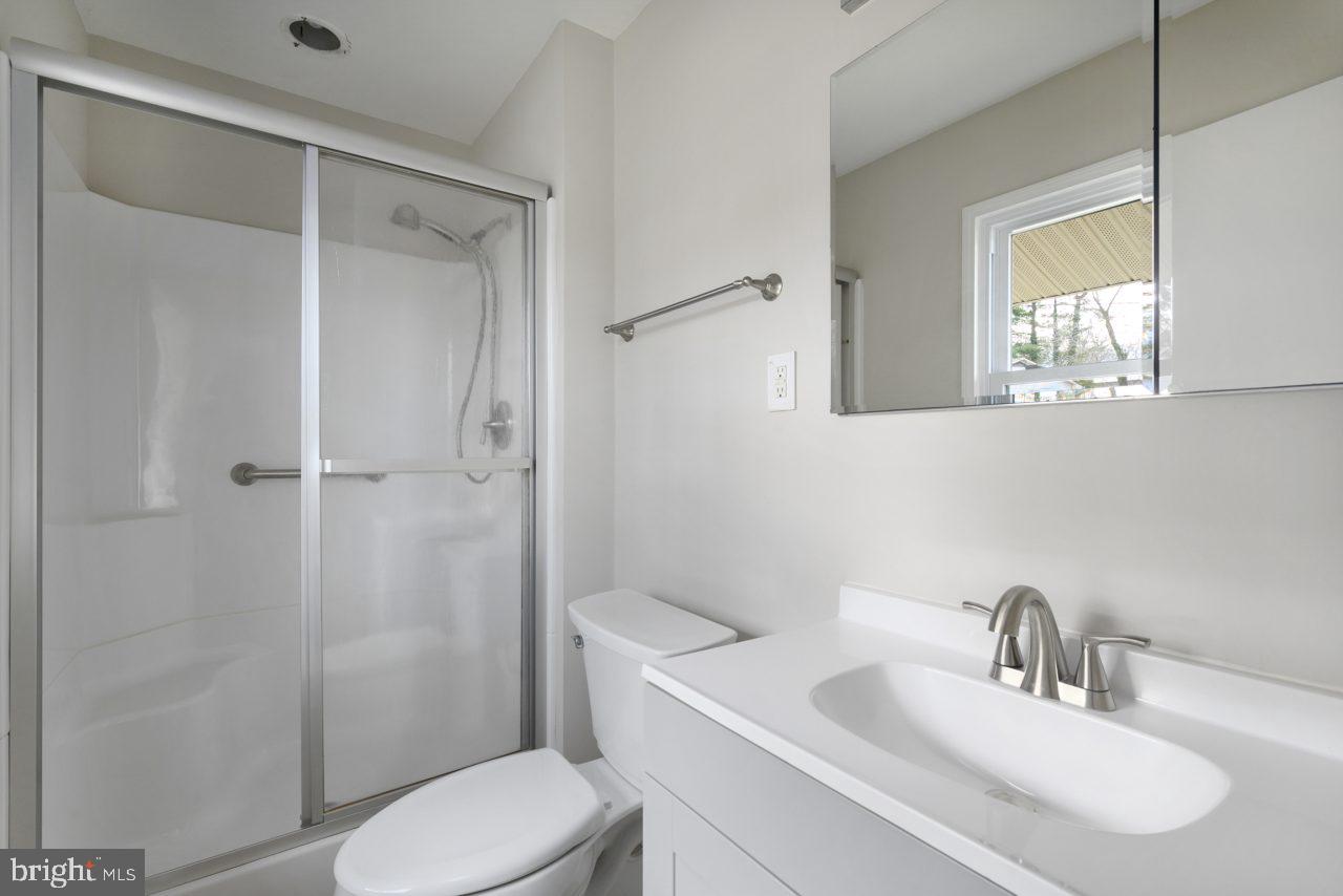 2004 Brierhill Road Fort Washington, MD 20744 - Photo 16 of 42 a bathroom with a sink toilet and shower