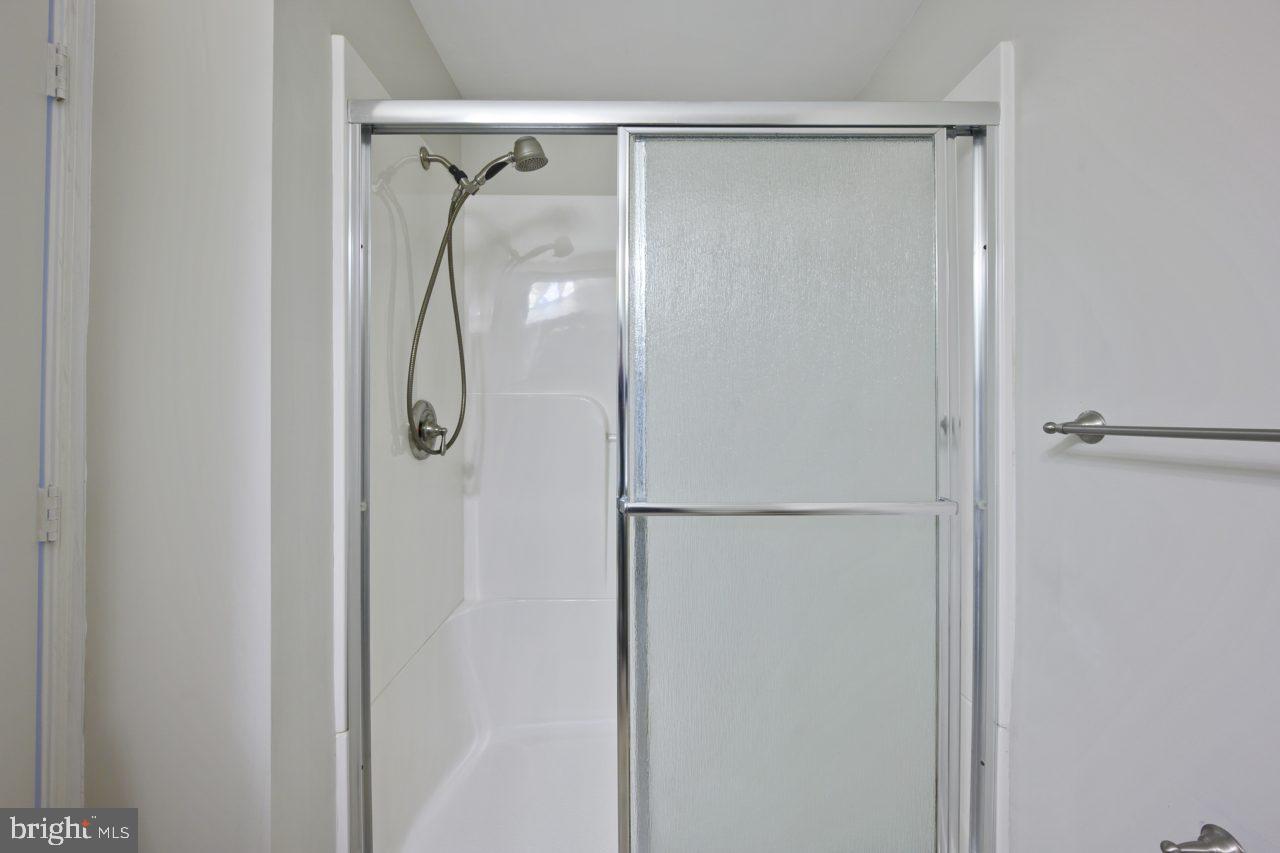 2004 Brierhill Road Fort Washington, MD 20744 - Photo 17 of 42 a bathroom with a glass shower door