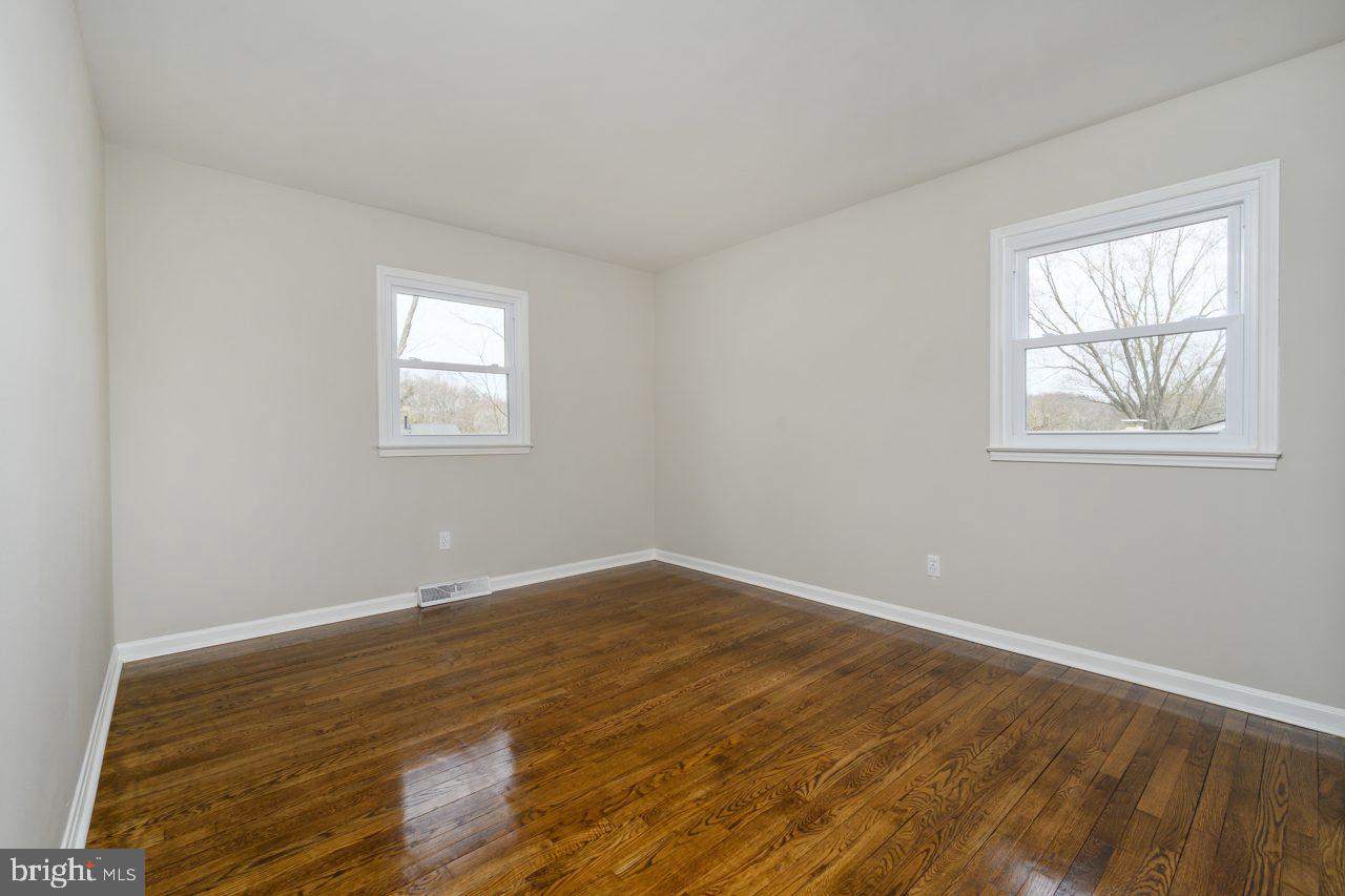 2004 Brierhill Road Fort Washington, MD 20744 - Photo 20 of 42 an empty room with wooden floor and windows