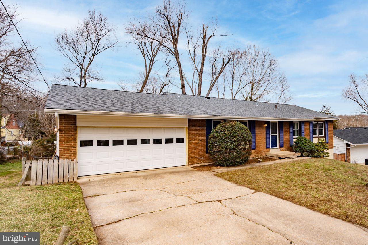 2004 Brierhill Road Fort Washington, MD 20744 - Photo 2 of 42 a front view of a building with a garden