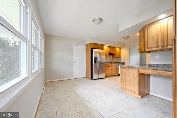 a view of a kitchen with a sink and a window
