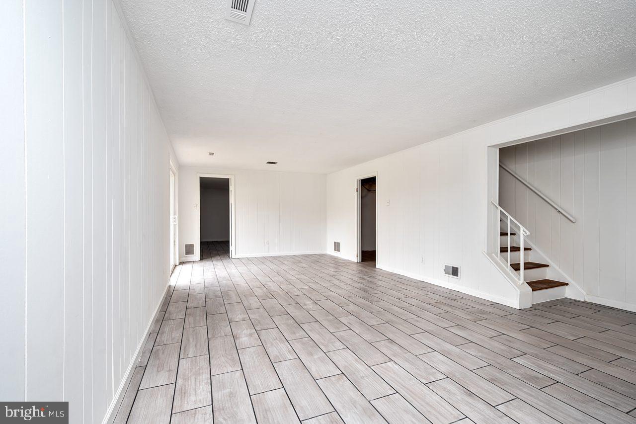 2004 Brierhill Road Fort Washington, MD 20744 - Photo 35 of 42 a view of an empty room with wooden floor