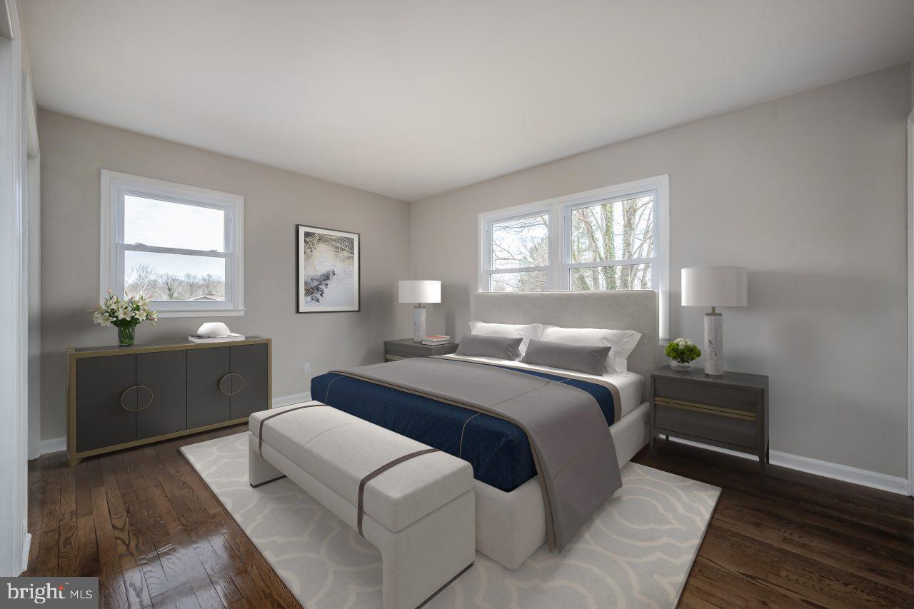 2004 Brierhill Road Fort Washington, MD 20744 - Photo 7 of 42 a bedroom with a bed and wooden floor