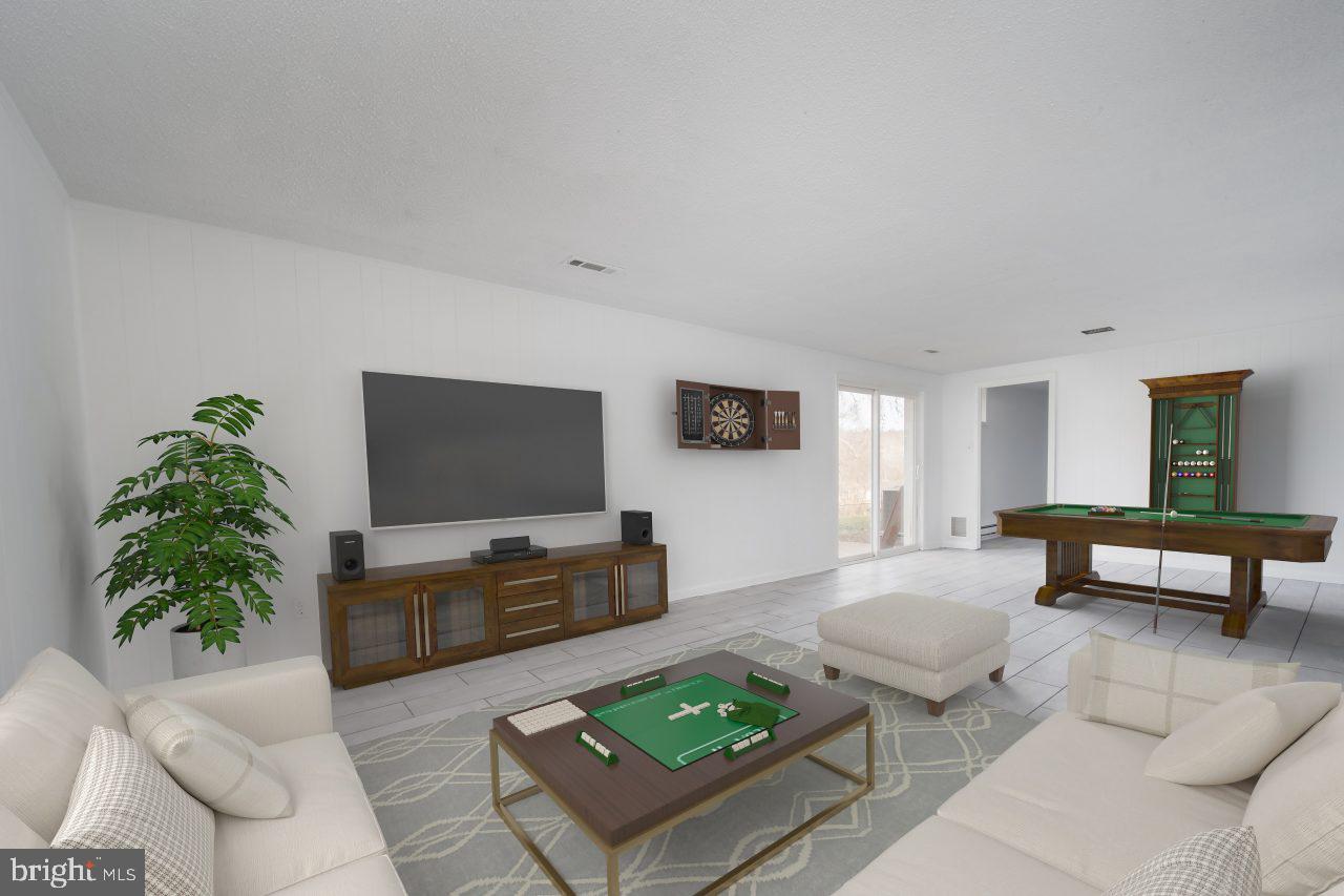 2004 Brierhill Road Fort Washington, MD 20744 - Photo 8 of 42 a living room with furniture and a flat screen tv