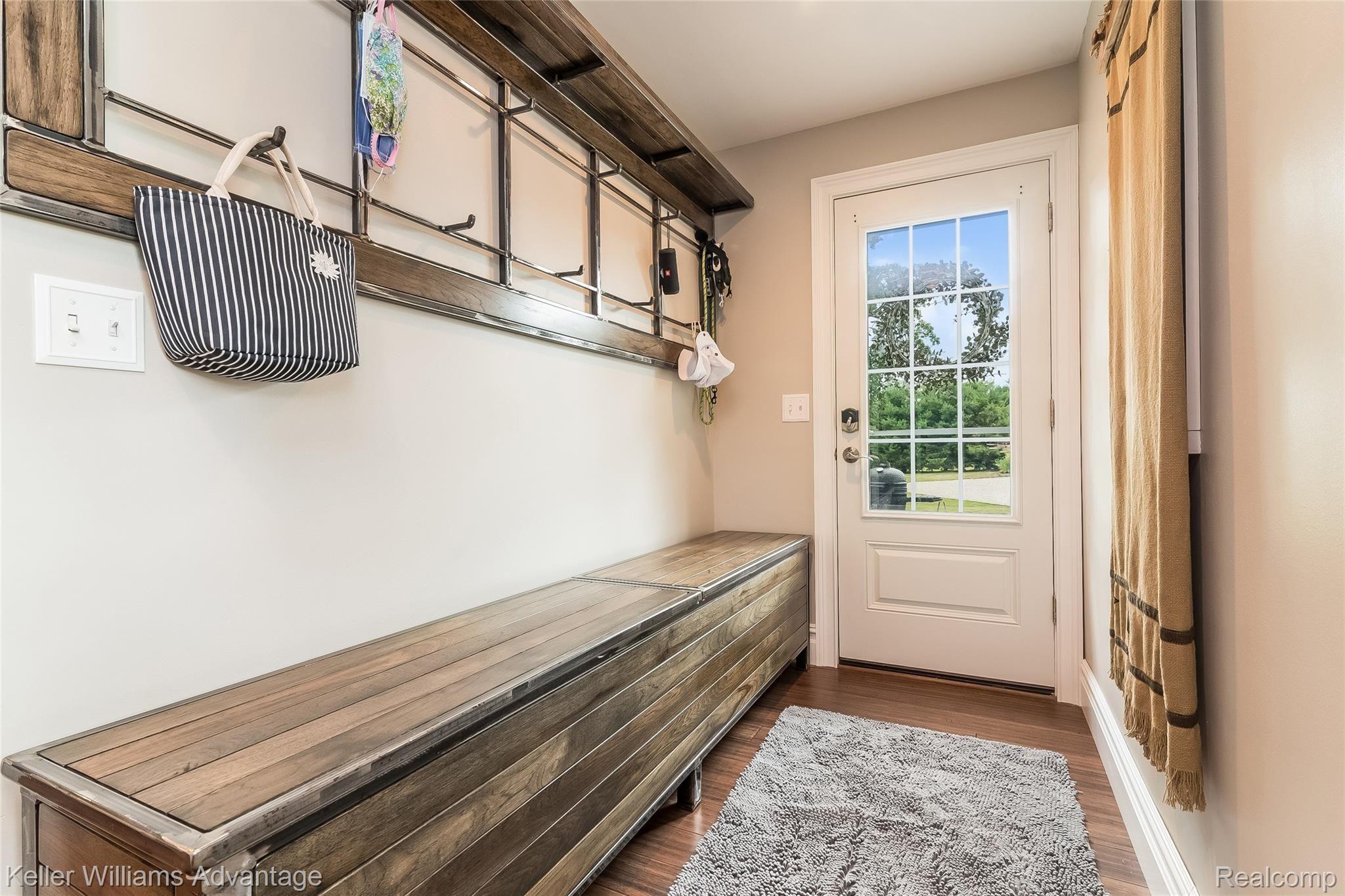 5385 Mack Road Howell, MI 48855 - Photo 24 of 59 Back door entry / mud room space. Recessed lighting and hand-scraped wood floors throughout home.