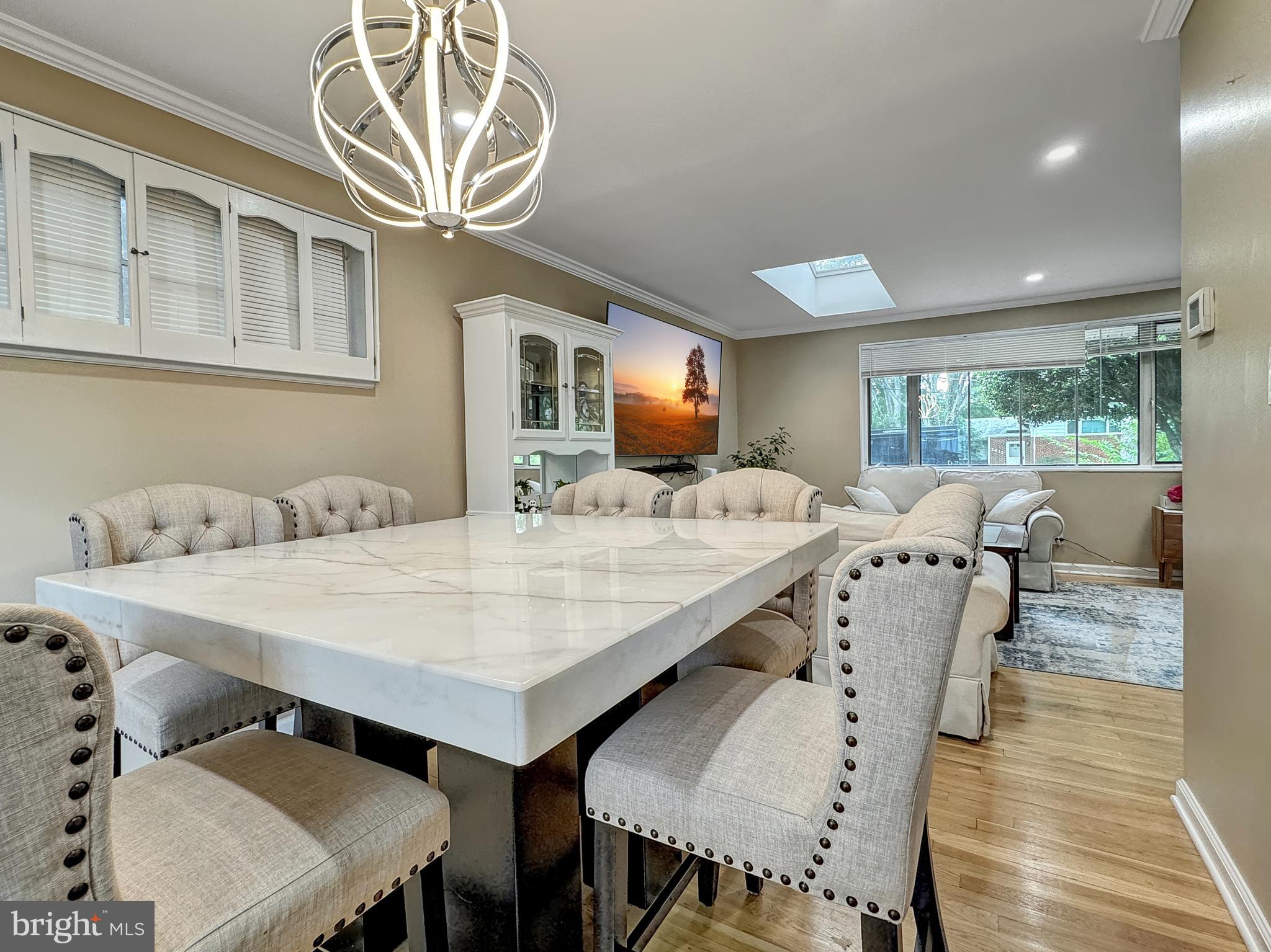 2408 Lillian Drive Silver Spring, MD 20902 - Photo 16 of 54 a view of a dining room with furniture and wooden floor