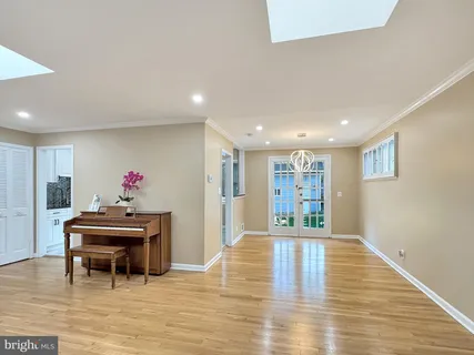 a living room with furniture and a kitchen view
