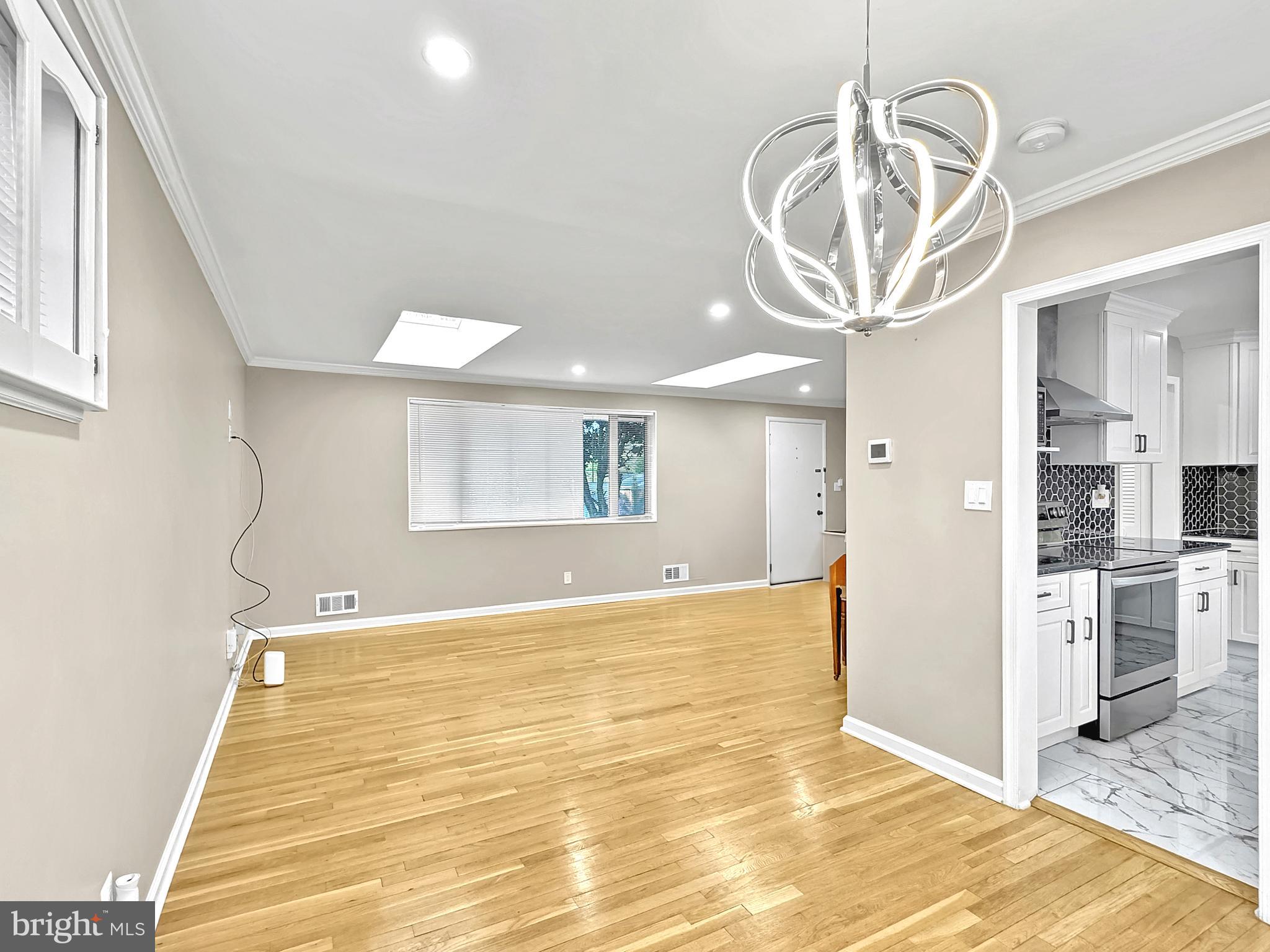 2408 Lillian Drive Silver Spring, MD 20902 - Photo 5 of 54 a view of a hallway with a chandelier