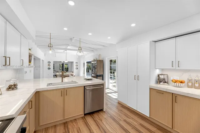 a spacious bedroom with a large bed and a large window