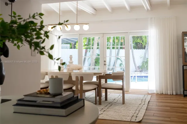 a room with wooden floor and gym equipment