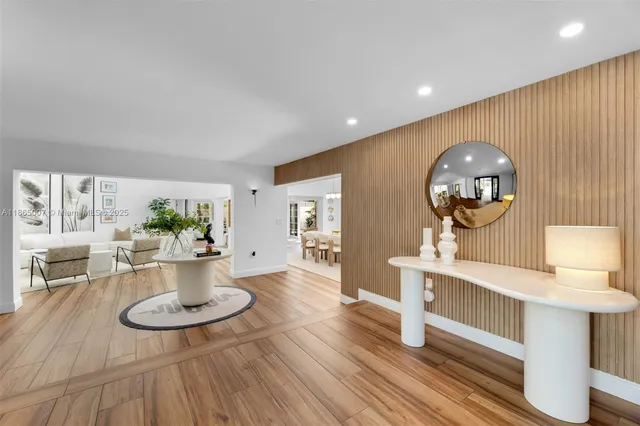 a view of a living room and a wooden floor