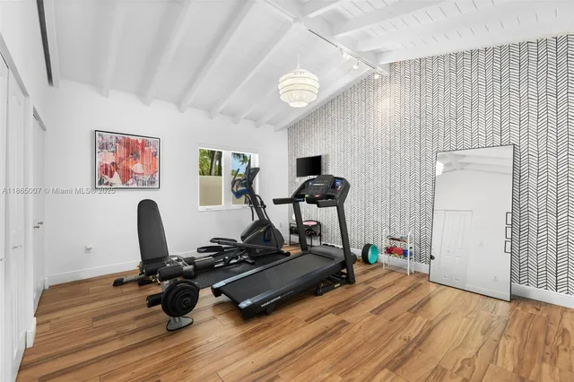a balcony with furniture and a potted plant