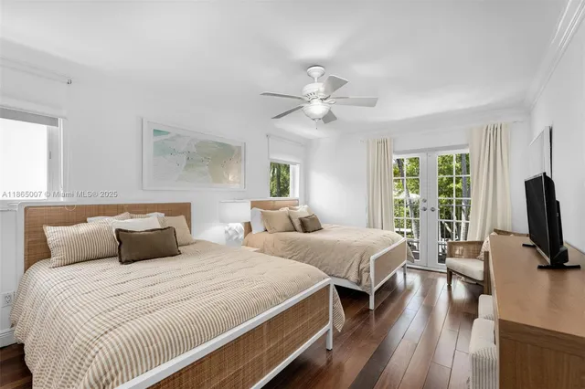 a view of patio with chairs and table under an umbrella
