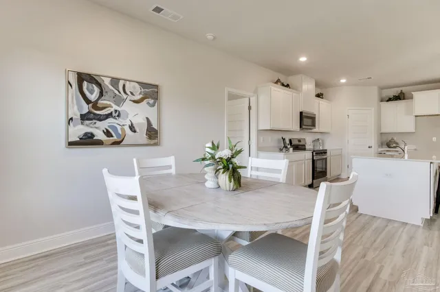 a view of a dining room with furniture