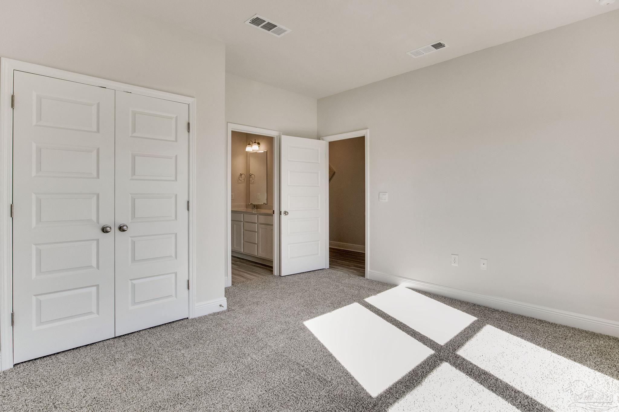 3423 Crossvine Road Cantonment, FL 32533 - Photo 28 of 35 an empty room with closet