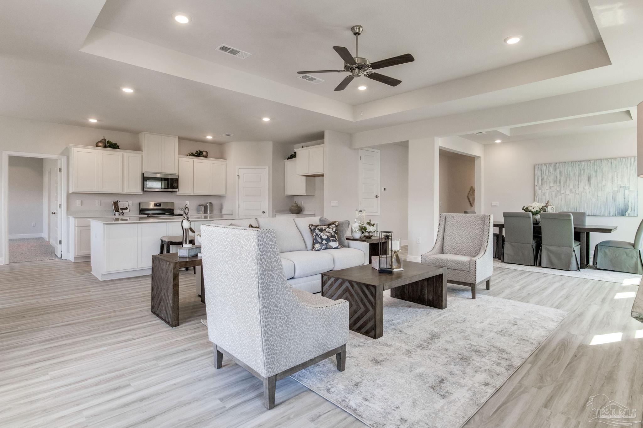 3423 Crossvine Road Cantonment, FL 32533 - Photo 5 of 35 a living room with lots of furniture and kitchen view