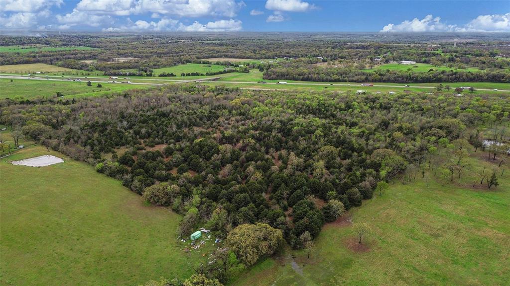 0 Co Road Terrell, TX 75161 - Photo 5 of 10 a view of a lush green space with a lake view
