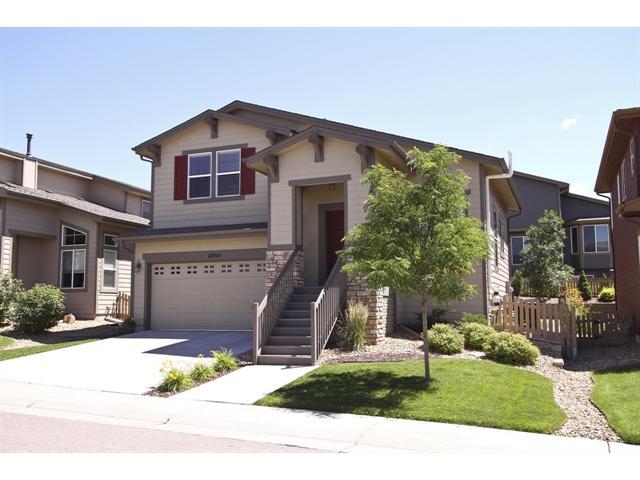 10914 Brooklawn Road Highlands Ranch, CO 80130 - Photo 1 of 1 a front view of a house with a yard