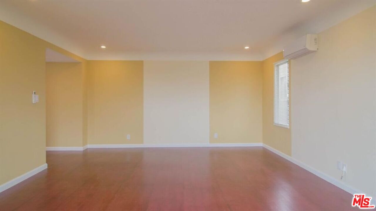 1437 South Ridgeley Drive Los Angeles, CA 90019 - Photo 17 of 37 a view of empty room