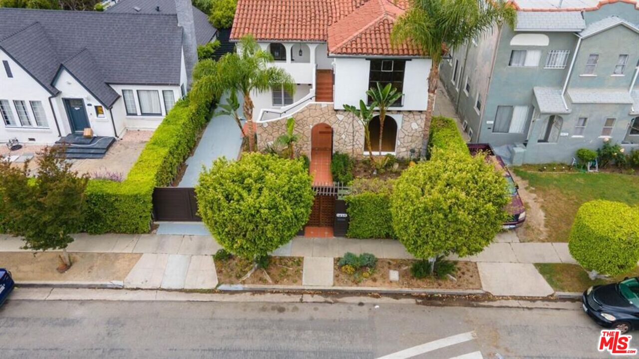 1437 South Ridgeley Drive Los Angeles, CA 90019 - Photo 34 of 37 front view of a house with a garden