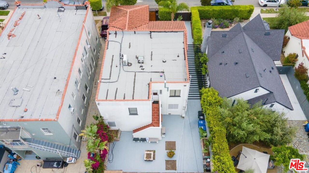 1437 South Ridgeley Drive Los Angeles, CA 90019 - Photo 35 of 37 an aerial view of residential houses with outdoor space and parking