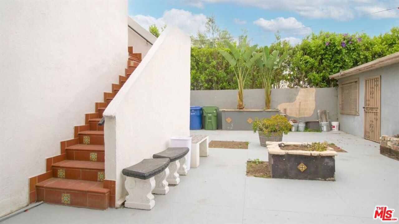 1437 South Ridgeley Drive Los Angeles, CA 90019 - Photo 10 of 37 a view of a patio with couches and potted plants
