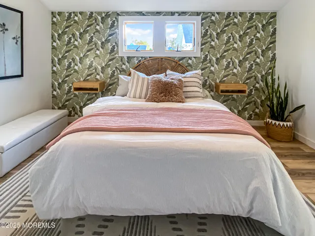 a bedroom with a bed and a couch