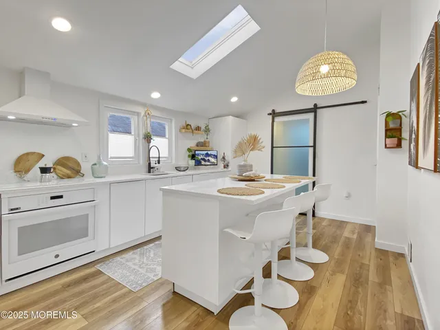 a kitchen with a sink appliances and cabinets