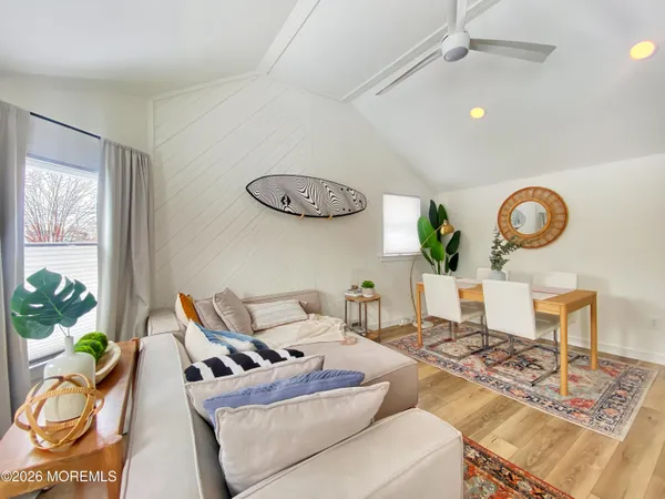 a living room with furniture and a table