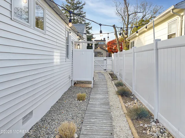 a view of a backyard with sitting area