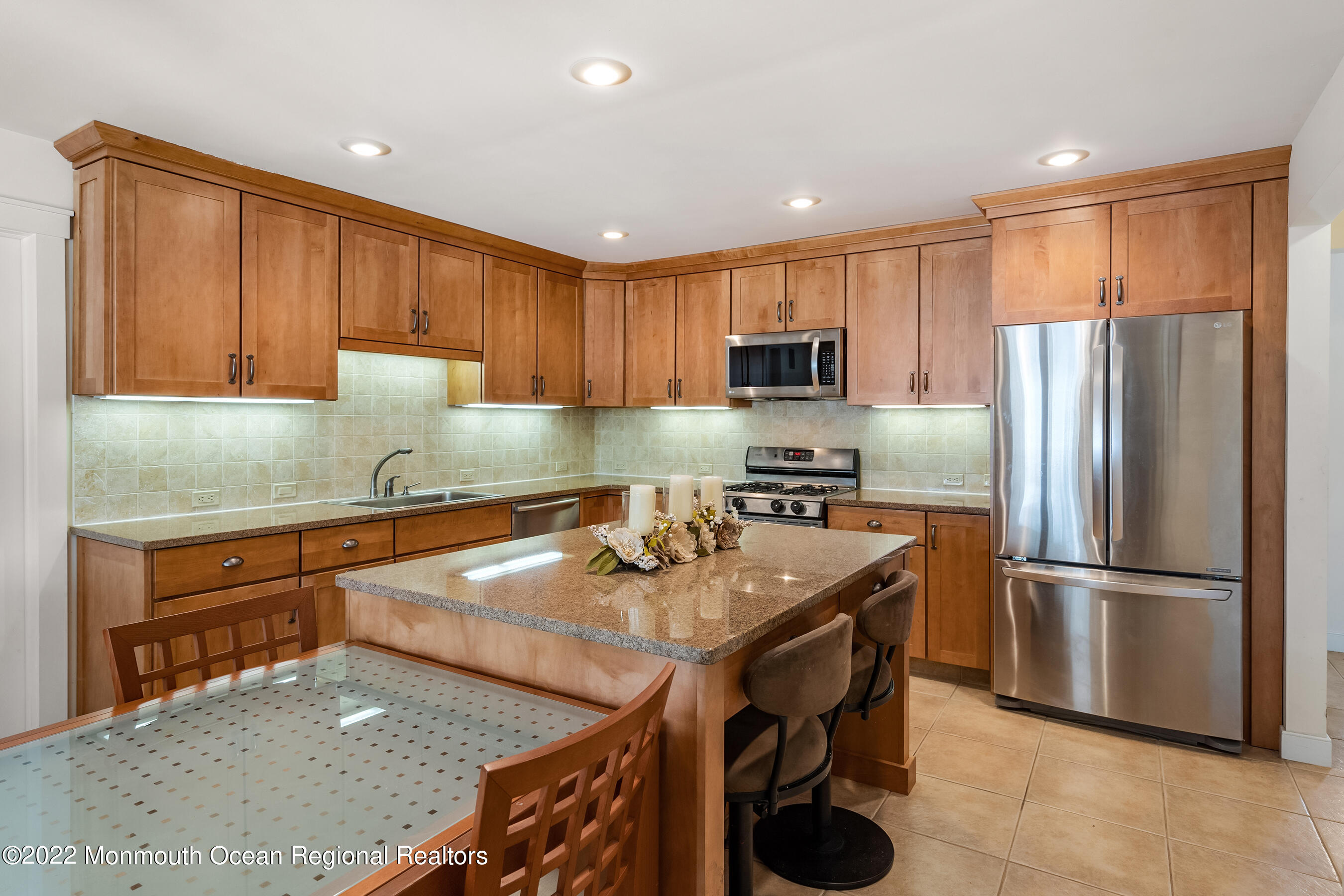 104 Caldwell Road Barnegat, NJ 08005 - Photo 12 of 35 a kitchen with stainless steel appliances granite countertop a refrigerator a stove top oven a sink and dishwasher