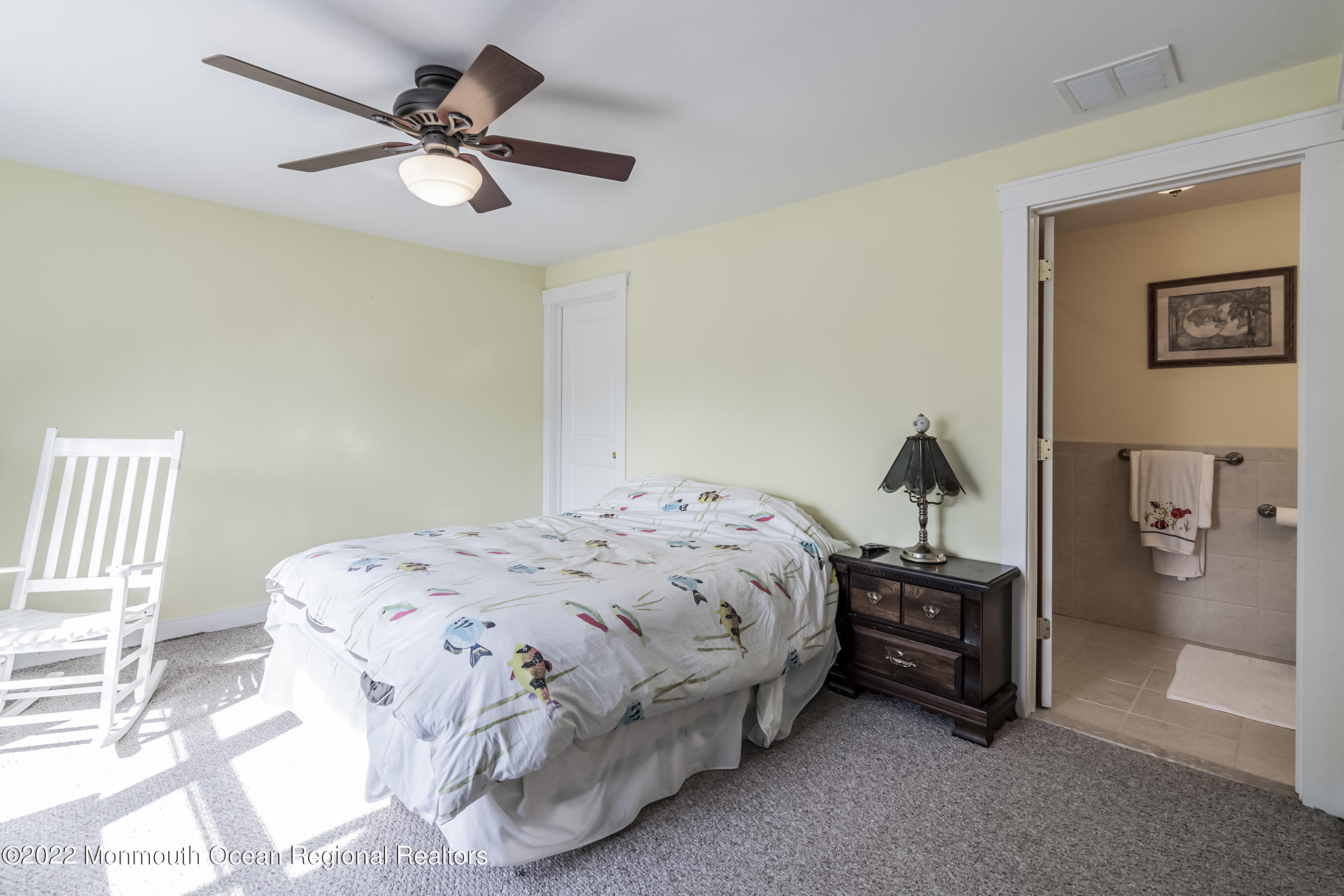 104 Caldwell Road Barnegat, NJ 08005 - Photo 15 of 35 a bedroom with a bed and a chandelier