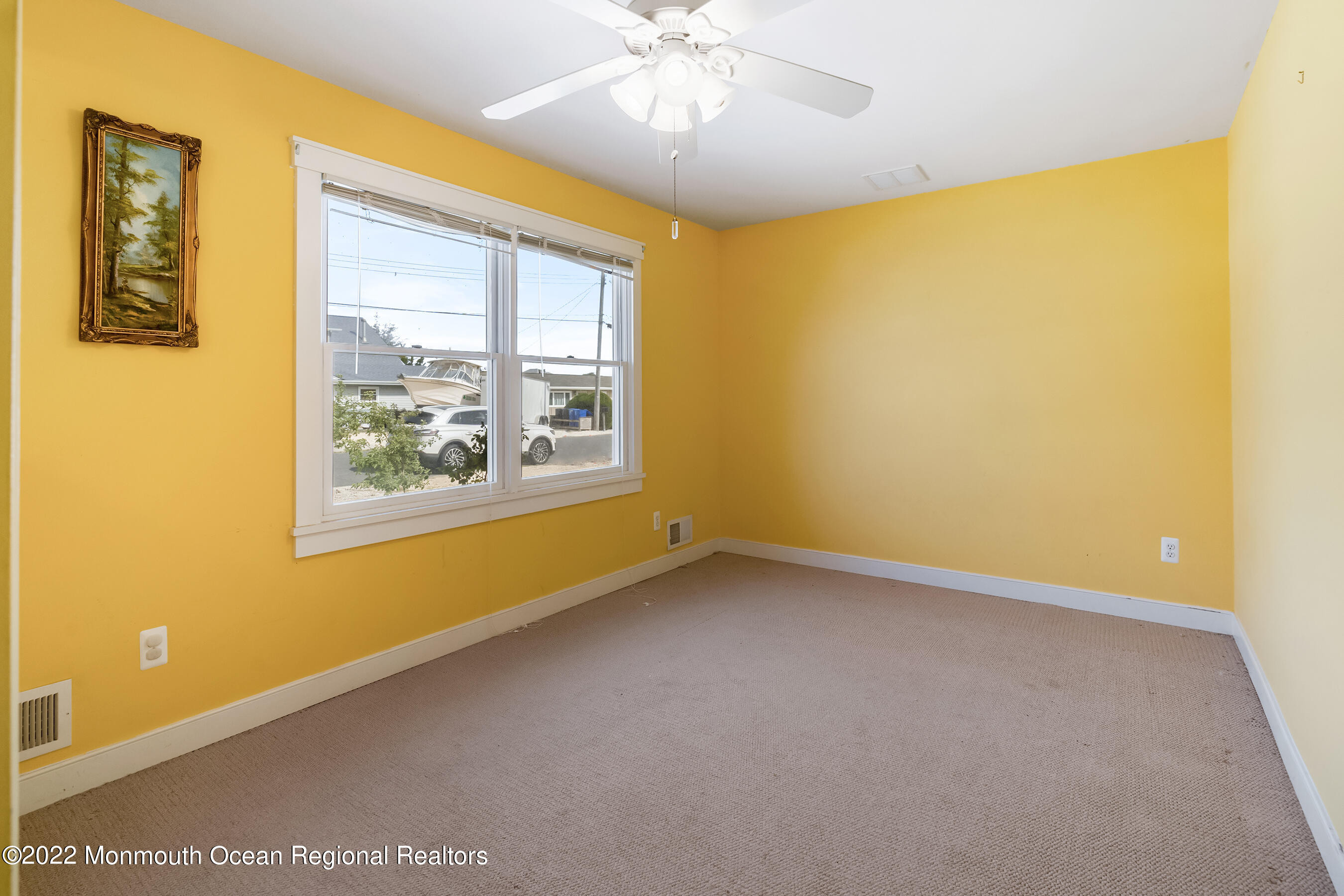 104 Caldwell Road Barnegat, NJ 08005 - Photo 9 of 35 a view of an empty room with a window