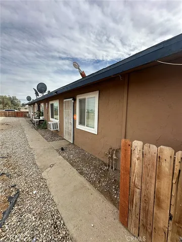 a front view of a house with parking space