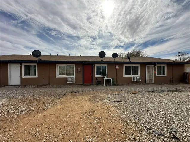 front view of a house with a dry yard