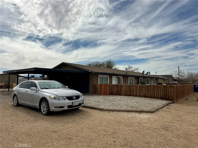a view of a car parked in front of a house