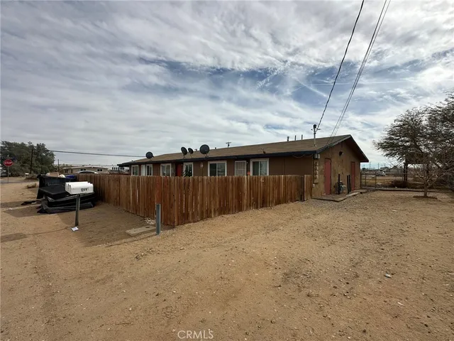 a terrace of a house with wooden fence