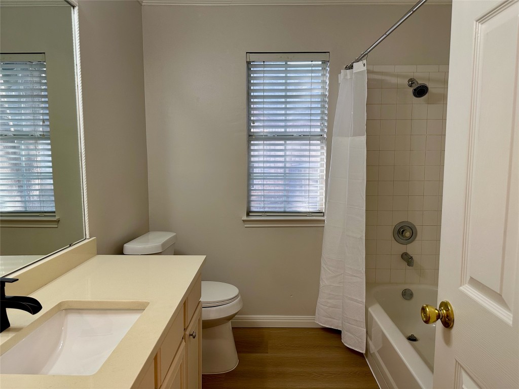 104 Benchmark Street Georgetown, TX 78626 - Photo 26 of 39 a bathroom with a sink a toilet and shower