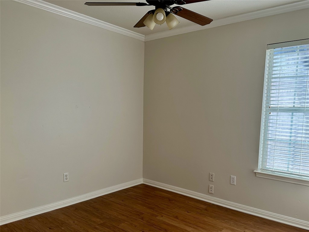 104 Benchmark Street Georgetown, TX 78626 - Photo 28 of 39 an empty room with a window and wooden floor
